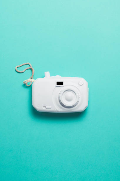 istock retro camera surrealism abstract concept. turquoise background 1153847003