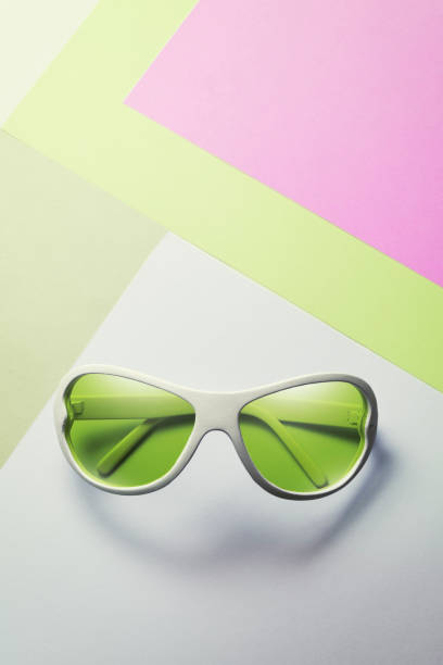 istock Green lime sunglasses on pastel multicolor paper trendy background. Minimal concept 1153847005