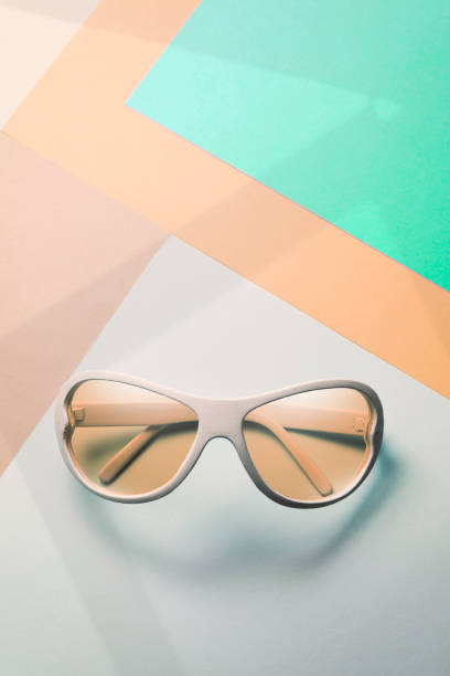 sunglasses on pastel multicolor paper trendy background. Minimal concept