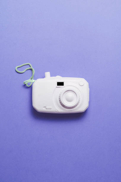 istock retro camera surrealism abstract concept. pastel color background 1153847146