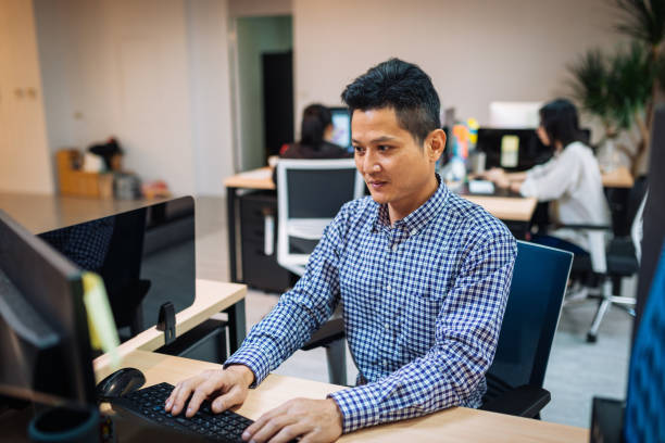 istock Businessman in Asia using online banking 1153851824