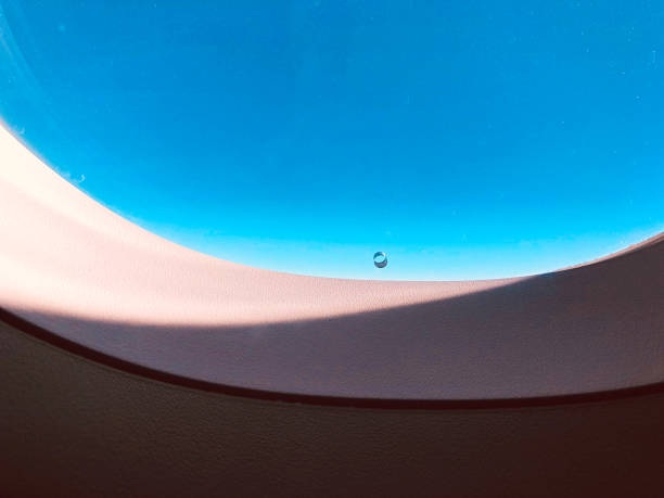 istock Airplane window hole for cabin pressure and safe flight. 1153852190