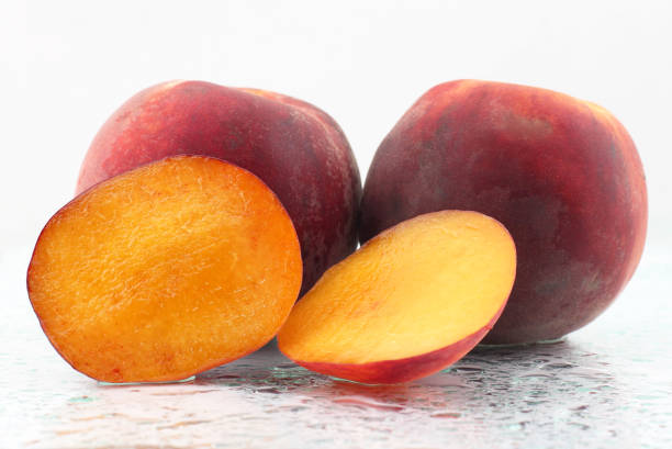 istock two ripe peach on a white background 1153855077