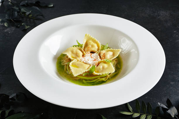 tortellini with shrimps or seafood ravioli, young zucchini ragout top view - hot couture imagens e fotografias de stock