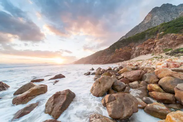 Photo of Cloudy sunset over Dappat se Gat Beach, South Africa