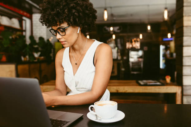 istock African woman at cafe 1153859074