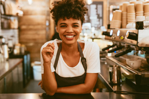 istock Female barista behind counter 1153859416