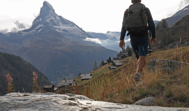 istock Hiker explores the hills flanking the Matterhorn 1153860929