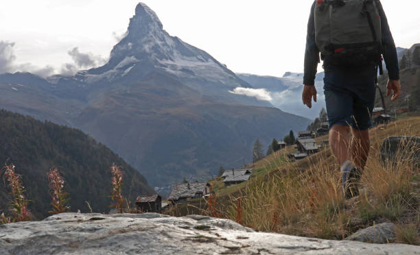 istock Hiker explores the hills flanking the Matterhorn 1153860947