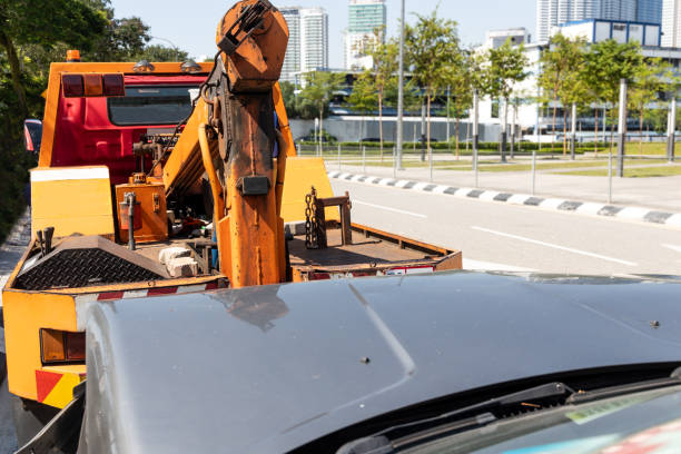 istock Tow truck towing a broken down car in emergency 1153860984