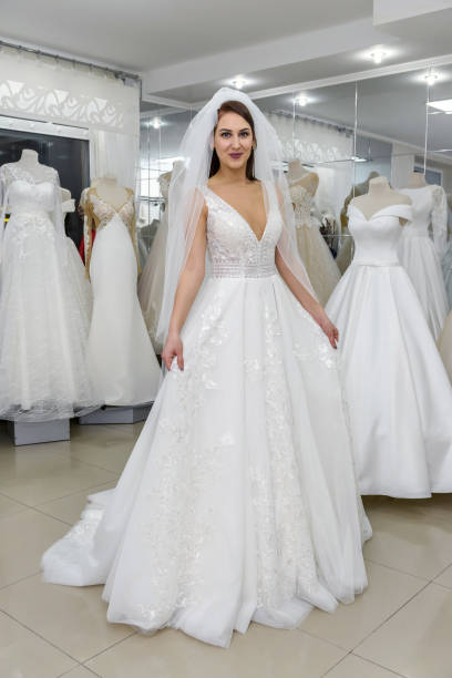 istock Attractive young bride is smiling in wedding salon 1153865593