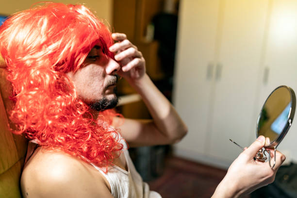 istock Bisexual Person Doing a Makeup at Home 1153865840