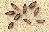 conceptual representation of a drought with an aerial view of boats on a dry lake