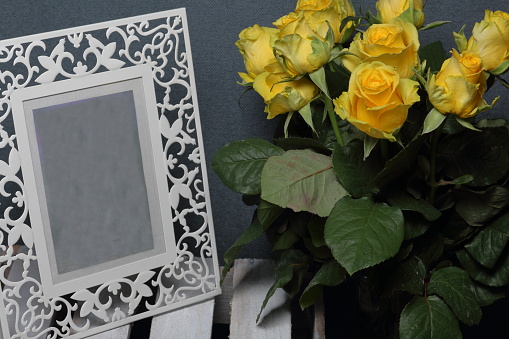 Golden frame with flowers on marble