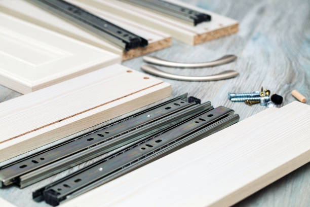 istock Assembling the bedside table, tools and materials, full extension Ball guides and wooden sides 1153869246