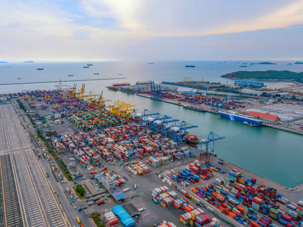 aerial top view of container cargo ship in the export and import business and logistics international goods in urban city. shipping to the harbor by crane in laem chabang, chon buri, thailand - harbor cargo container commercial dock container imagens e fotografias de stock