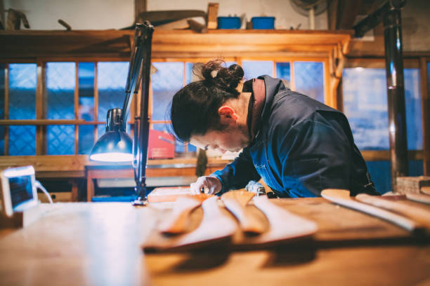 istock Asian man making craft from wood 1153872585