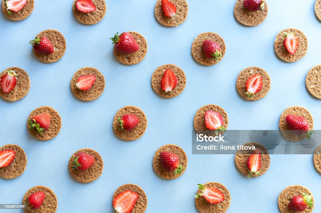 pattern of strawberries Pattern with a repetitive rhythm diagonal sandwiches of strawberries and biscuits. Abstract Stock Photo