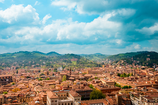 landscape of bologna during cloudy spring day in all its beauty with churches and architecture and hills on the horizon