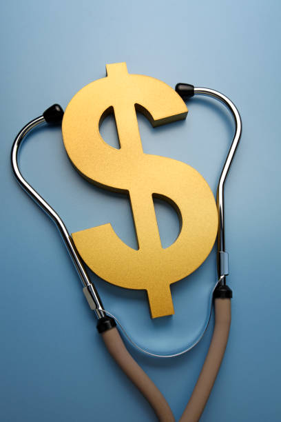 A stethoscope attached to a gold dollar sign on a blue background.