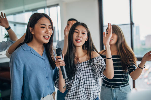 istock Friends having karaoke party 1153879624