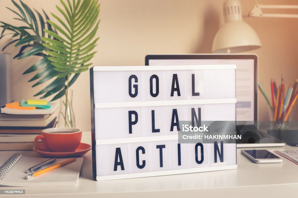 Goal,plan,action text on light box on desk table in home office Goal,plan,action text on light box on desk table in home office.Business motivation or inspiration,performance of human concepts ideas Aspirations Stock Photo