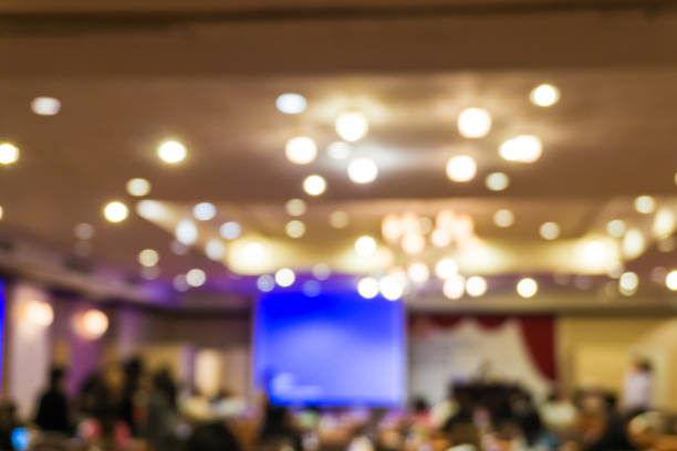 istock Blurred people meeting in seminar room 1153880207