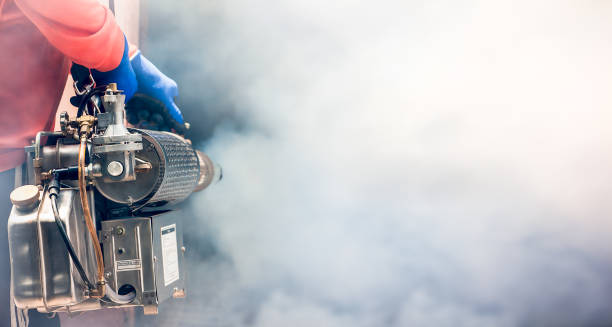 a man use fumigation mosquitoes machine for kill mosquito carrier of zika virus and dengue fever prevention outbreak in school at the rainy season.soft and blur focus. - midge imagens e fotografias de stock