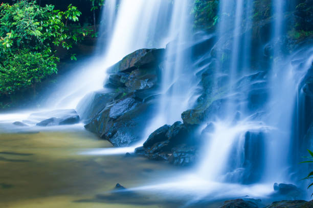 istock Picturesque tropical waterfall on summer morning. 1153880406