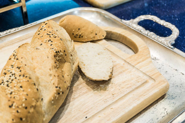 istock Baked mixed of dark whole wheat and white bread on table 1153880466