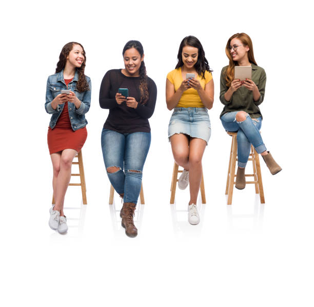 istock Pretty college girls using electronic devices 1153880664