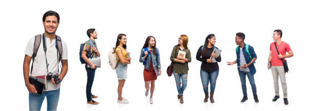istock Latin young men holding a camera standing with friends 1153880699