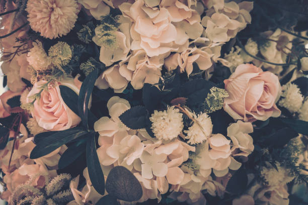 istock Beautiful Artificial Flowers Background, Vintage style; 1153881263