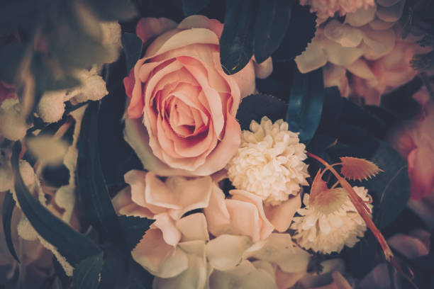 istock Beautiful Artificial Flowers Background, Vintage style; 1153881271