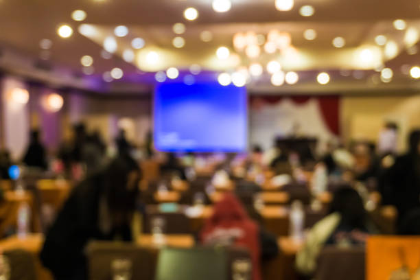 istock Blurred people meeting in seminar room 1153881636