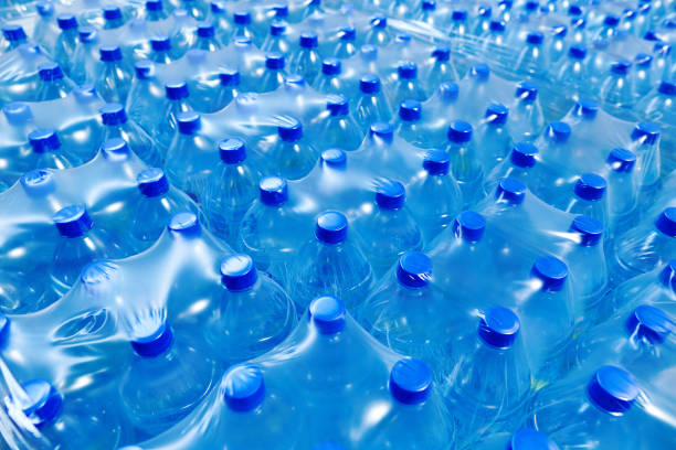 istock Many packaged blue mineral water bottles 1153882120