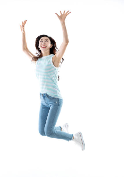 istock Beautiful woman jumping on white background 1153882777