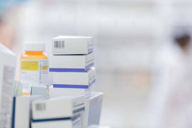 Boxes and bottles of medicine are ready to be shelved Boxes and bottles for medicine are stacked and ready to be organized on the pharmacy's shelves. ointment photos stock pictures, royalty-free photos & images