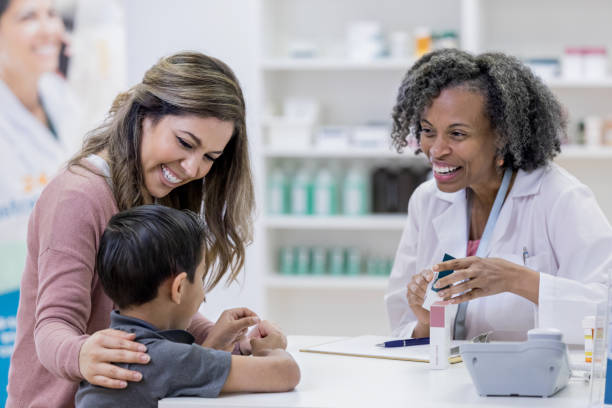 istock Hispanic boy and African American pharmacist enjoy conversation 1153885303