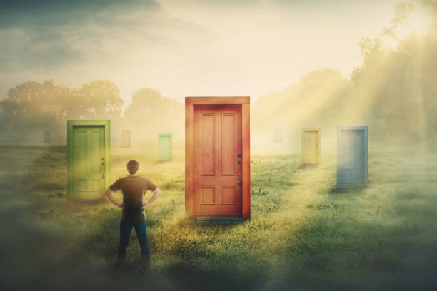 doubtful man in front of many different doors choosing one. difficult decision, concept of important choice in life, failure or success. ways to unknown future career development. - challenge people symbol choice imagens e fotografias de stock