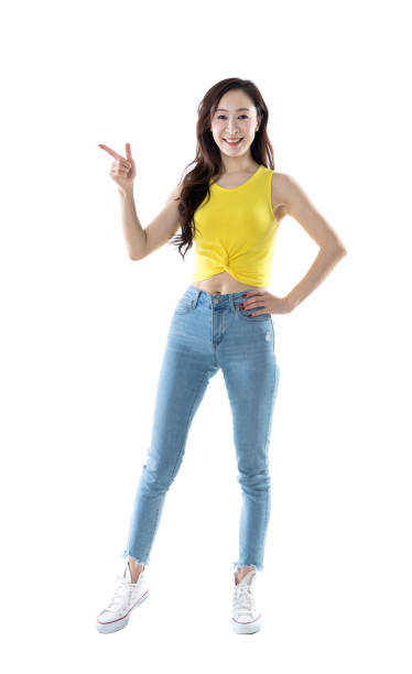 istock Beautiful woman pointing up on white background 1153886528