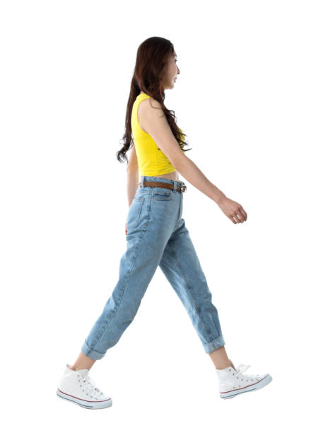 Woman walking on white background Woman walking on white background. yellow belt stock pictures, royalty-free photos & images