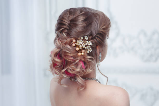 istock Beautiful air wedding hairstyle view from the back. 1153887820