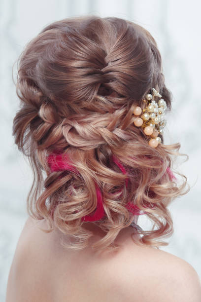 istock Beautiful air wedding hairstyle view from the back. 1153887937