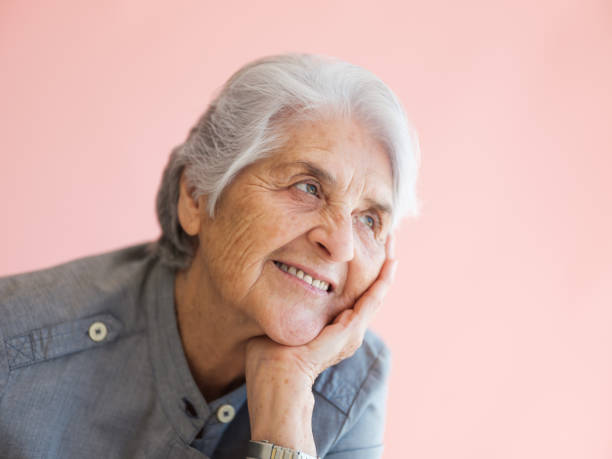 istock Elderly woman remembering old times 1153889302