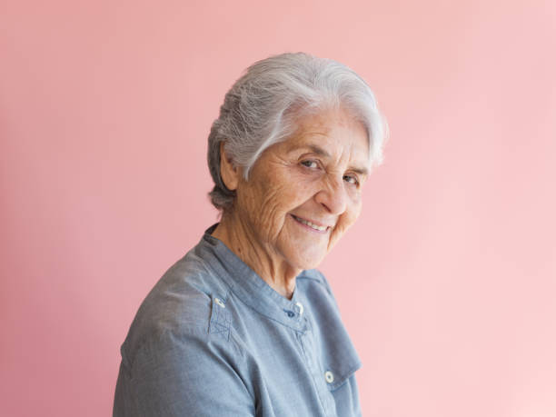 Happy senior woman turning to look at the camera