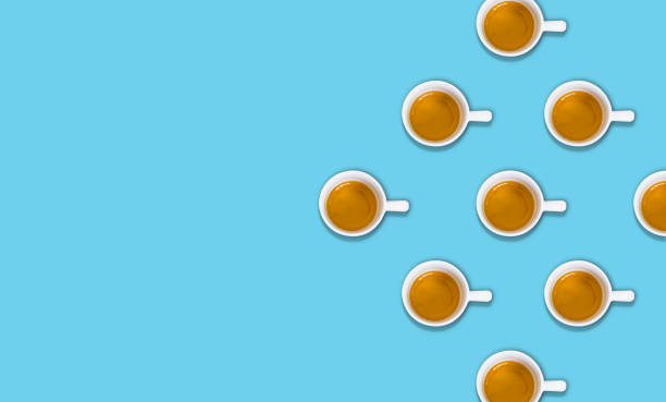 istock minimalist pattern with a top view of a group of coffee cups on a light blue pastel table 1153889488