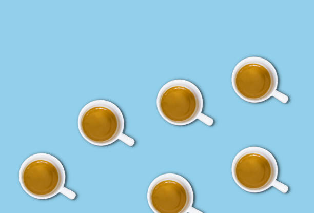 istock minimalist pattern with a top view of a group of coffee cups on a light blue pastel table 1153889509