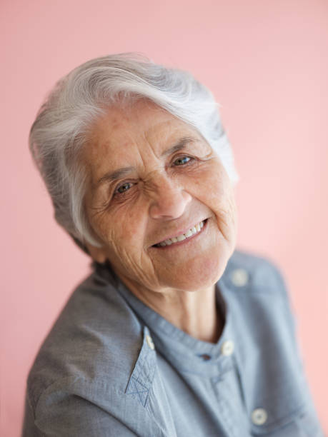 istock An elderly woman with a sweet smile 1153889561