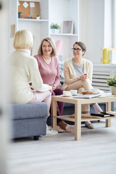 istock Cheerful Women Chatting 1153889777
